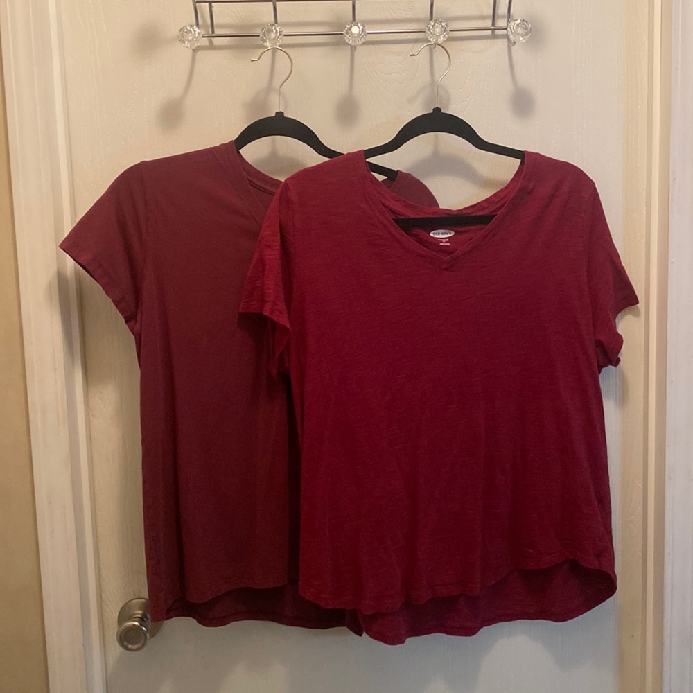 two maroon colored tee shirts one is XL and one L